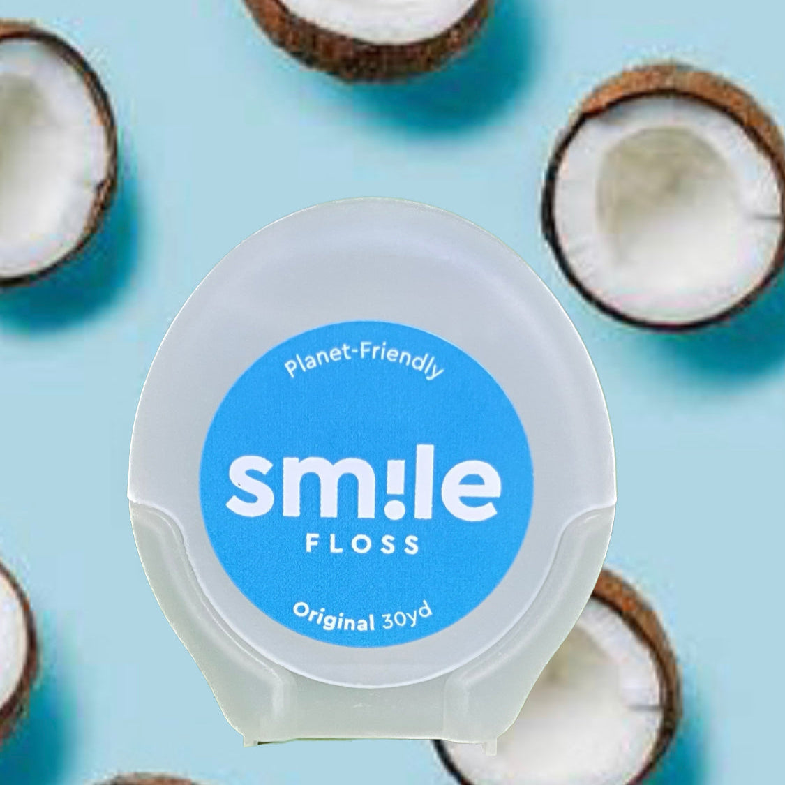 Pack of Smile Floss on a light blue background with coconuts