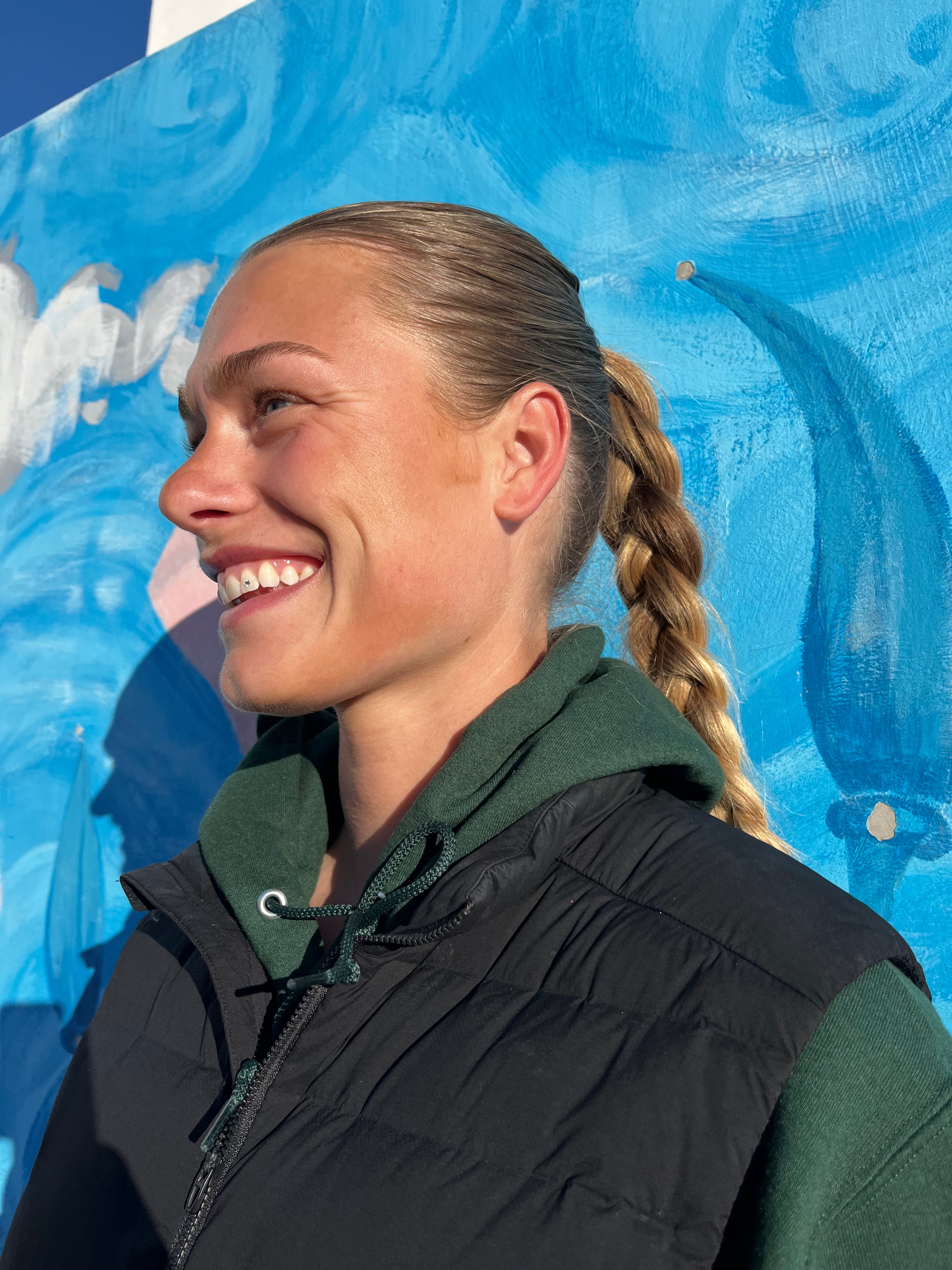 High-quality close-up of a woman smiling to promote Smile Floss